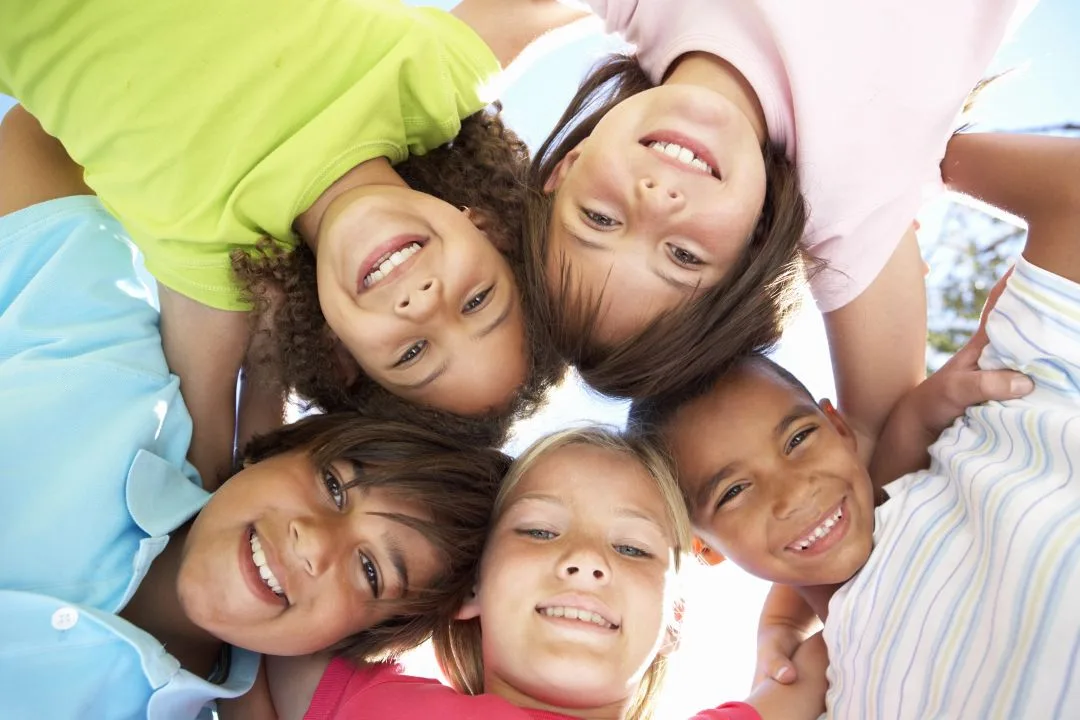 Depositphotos_4838845_XL_resized A circle of happy kids